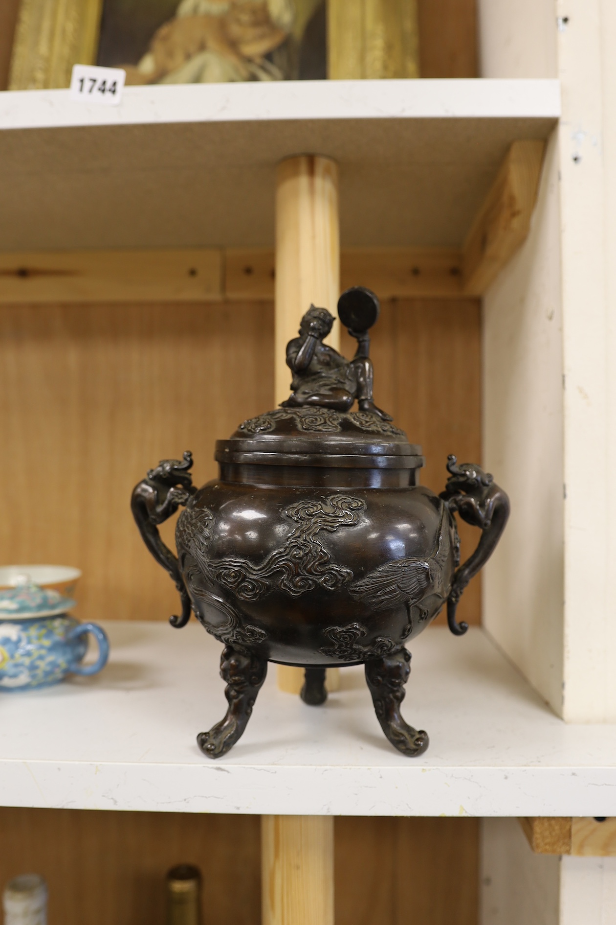 A Japanese bronze dragon handled censer with figural finial to cover, Meiji period, 24cm high. Condition - good